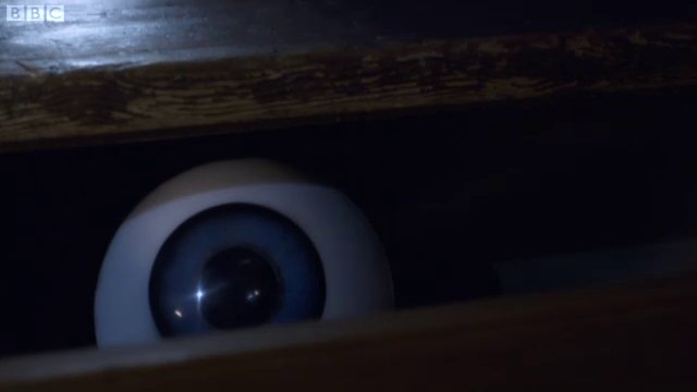 A horrible disembodied eye in a desk drawer
